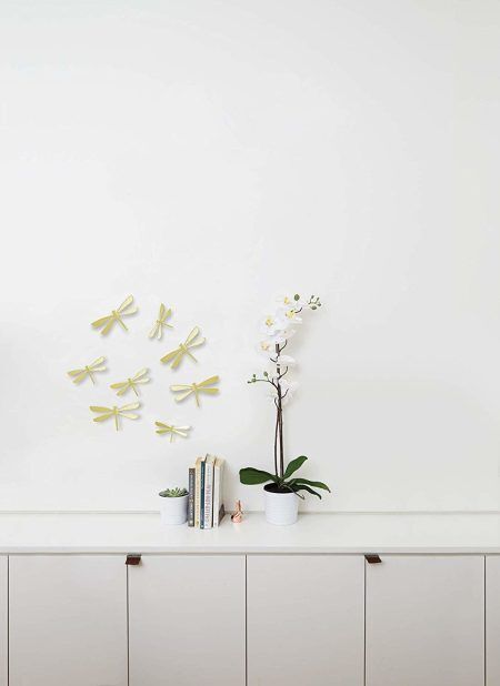 <p><span style="font-size: small;"><strong>UMBRA Комплект декорация за стена “WALLFLUTТER“ </strong></span><br /><span style="font-size: small;"><strong>• </strong></span><strong>Цвят:</strong> месинг<br />• <strong>Ефект 3D<br />• Сет от 8 бр водни кончета</strong><br />•<strong> Закрепване за стена (с включени двойнолепящи лепенки)</strong><br />• <strong>Четири</strong> р<strong>азмера в комплект:</strong> от (11,4 x 6,4 ) до (14,6 х 8,3) cm<br />• <strong>Материал:</strong> пластмаса<br /><strong>Производител: UMBRA / Канада<br /></strong><em><strong>DESIGN: ALAN WISNIEWSKI & MARION LANKTREE</strong></em></p><br />Марка: Umbra HK Limited <br />Модел: UMBRA 1013366-104<br />Доставка: 2-4 работни дни<br />Гаранция: 2 години