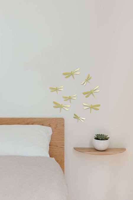 <p><span style="font-size: small;"><strong>UMBRA Комплект декорация за стена “WALLFLUTТER“ </strong></span><br /><span style="font-size: small;"><strong>• </strong></span><strong>Цвят:</strong> месинг<br />• <strong>Ефект 3D<br />• Сет от 8 бр водни кончета</strong><br />•<strong> Закрепване за стена (с включени двойнолепящи лепенки)</strong><br />• <strong>Четири</strong> р<strong>азмера в комплект:</strong> от (11,4 x 6,4 ) до (14,6 х 8,3) cm<br />• <strong>Материал:</strong> пластмаса<br /><strong>Производител: UMBRA / Канада<br /></strong><em><strong>DESIGN: ALAN WISNIEWSKI & MARION LANKTREE</strong></em></p><br />Марка: Umbra HK Limited <br />Модел: UMBRA 1013366-104<br />Доставка: 2-4 работни дни<br />Гаранция: 2 години