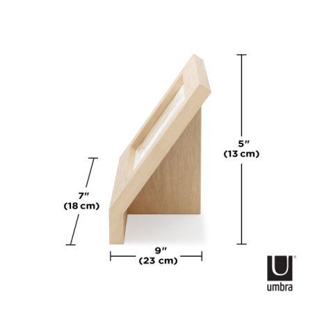 <p><strong>UMBRA Рамка за снимки “PODIUM“ - цвят натурално дърво - 10 х 15 см.</strong><br /><span><strong>• </strong></span><strong>Цвят:</strong><span> дърво</span><br /><span>• </span><strong>Размер на рамката:</strong><span> 23 x 17 x 22 см</span><br /><span>• </span><strong>Размер на снимката:</strong><span> 10 х 15 см.</span><br /><span>• </span><strong>Размер на опаковката:</strong><span> 21 х 5 х 19 см.</span><br /><span>• </span><strong>Тегло:</strong><span> 0,300 кг</span><br /><span>• </span><strong>Материал:</strong><span> Ясен, стъкло</span><br /><strong>Производител: UMBRA / Канада</strong><br /><em><strong>DESIGN: HENRY HUANG</strong></em></p><br />Марка: Umbra HK Limited <br />Модел: UMBRA 1016769-390<br />Доставка: 2-4 работни дни<br />Гаранция: 2 години