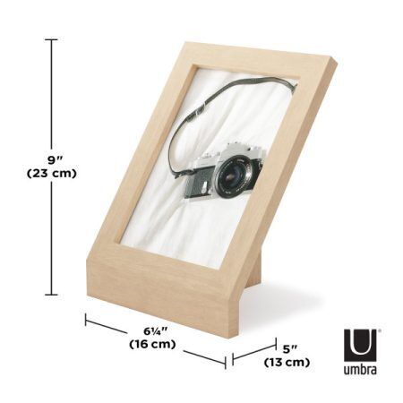 <p><strong>UMBRA Рамка за снимки “PODIUM“ - цвят натурално дърво - 13х18 см.</strong><br /><span><strong>• </strong></span><strong>Цвят:</strong><span> дърво</span><br /><span>• </span><strong>Размер на рамката:</strong><span> 16 x 13 x 26 см</span><br /><span>• </span><strong>Размер на снимката:</strong><span> 13 х 18 см.</span><br /><span>• </span><strong>Размер на опаковката:</strong><span> 19 х 5 х 26 см</span><br /><span>• </span><strong>Тегло:</strong><span> 0,400 кг</span><br /><span>• </span><strong>Материал:</strong><span> Ясен, стъкло</span><br /><strong>Производител: UMBRA / Канада</strong><br /><em><strong>DESIGN: HENRY HUANG</strong></em></p><br />Марка: Umbra HK Limited <br />Модел: UMBRA 1016772-390<br />Доставка: 2-4 работни дни<br />Гаранция: 2 години