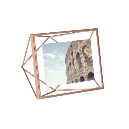 <p><span style="font-size: small;"><strong>UMBRA Рамка за снимки “PRISMA“ <br />• </strong></span><strong>Цвят:</strong> мед <br />• <strong>Размер на рамката:</strong> 15,3 x 20,3 x 7,6 cm<br />• <strong>Размер на снимката:</strong> 10 х 15 см<br /> • <strong>Материал:</strong> метал<br /><strong>Производител: UMBRA / Канада</strong><br /> <em><strong>DESIGN: SUNG WOOK PARK</strong></em></p><br />Марка: Umbra HK Limited <br />Модел: UMBRA 313016-880<br />Доставка: 2-4 работни дни<br />Гаранция: 2 години