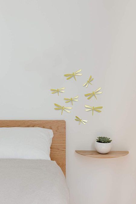 <p><span style="font-size: small;"><strong>UMBRA Комплект декорация за стена “WALLFLUTТER“ </strong></span><br /><span style="font-size: small;"><strong>• </strong></span><strong>Цвят:</strong> месинг<br />• <strong>Ефект 3D<br />• Сет от 8 бр водни кончета</strong><br />•<strong> Закрепване за стена (с включени двойнолепящи лепенки)</strong><br />• <strong>Четири</strong> р<strong>азмера в комплект:</strong> от (11,4 x 6,4 ) до (14,6 х 8,3) cm<br />• <strong>Материал:</strong> пластмаса<br /><strong>Производител: UMBRA / Канада<br /></strong><em><strong>DESIGN: ALAN WISNIEWSKI & MARION LANKTREE</strong></em></p><br />Марка: Umbra HK Limited <br />Модел: UMBRA 1013366-104<br />Доставка: 2-4 работни дни<br />Гаранция: 2 години